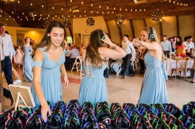 Bridal party choosing silent disco headphones