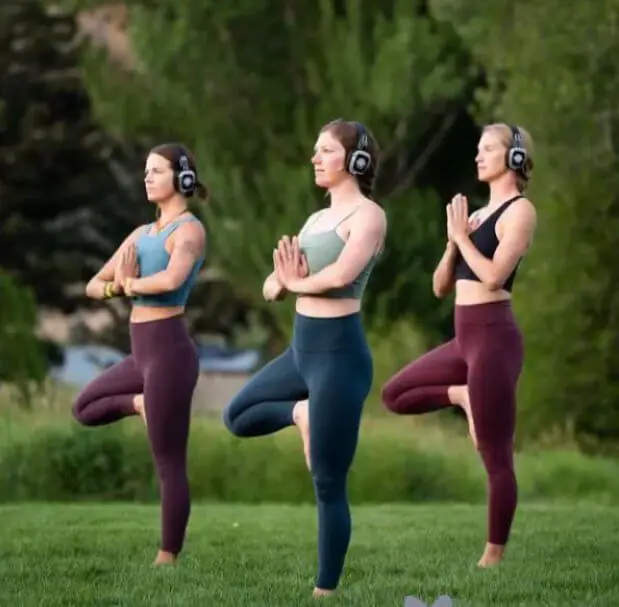Practicing yoga with Silent Disco Headphones